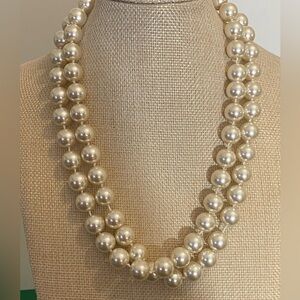 Faux pearl necklace.